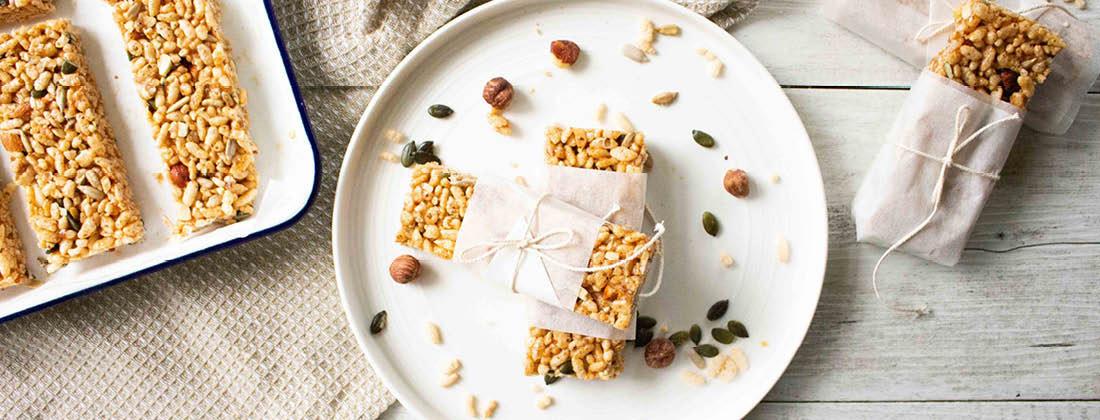 Nutty rice crispy treats served on white plate