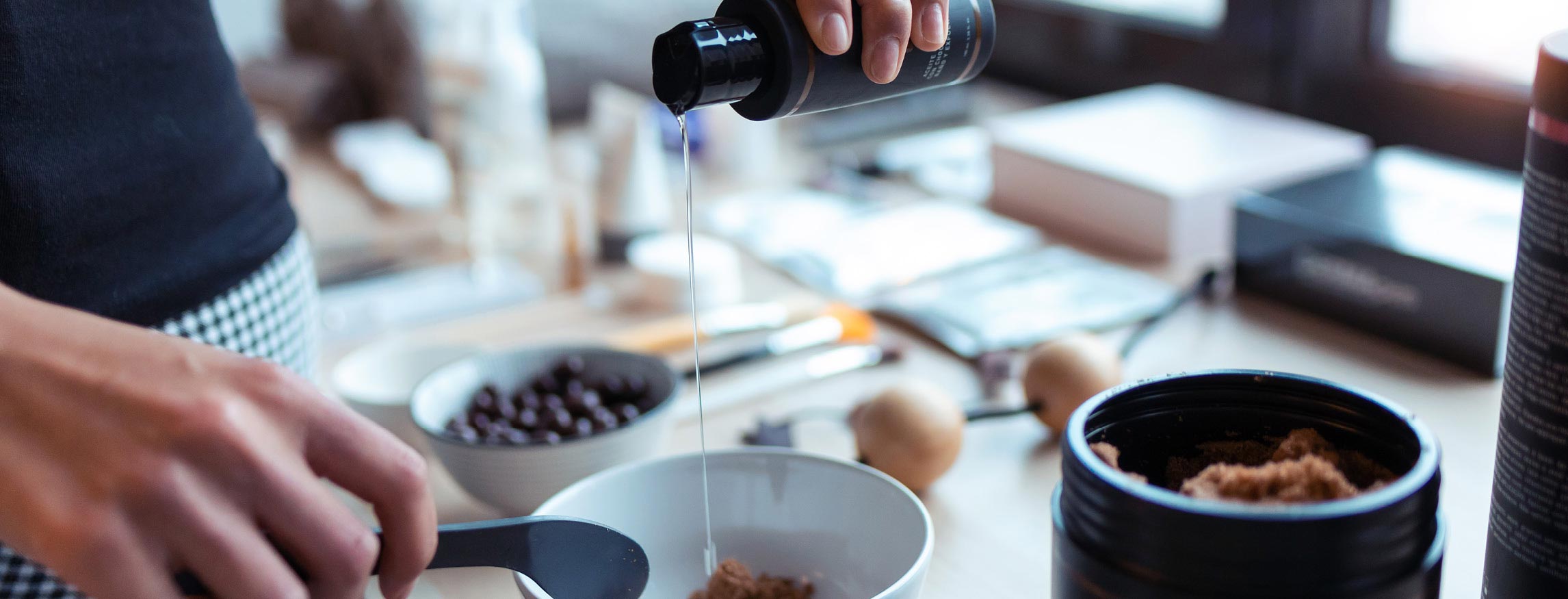 Person pours MCT Oil onto meal