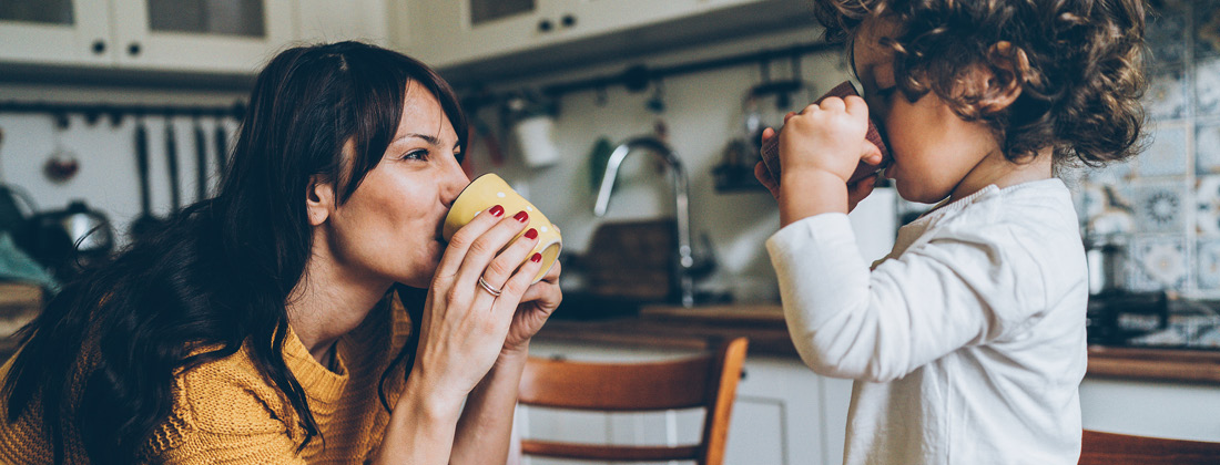 woman and child enjoying a healthy beverage