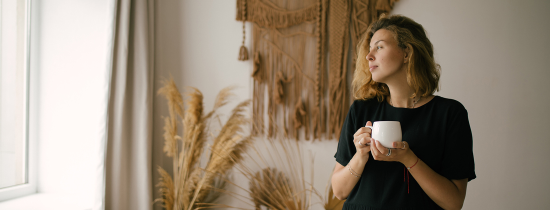 woman enjoying a hot drink with kava