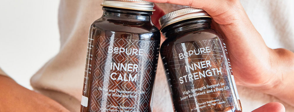 Woman's Hands Hold BePure Products Inner Calm And Inner Strength